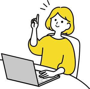パソコンの前でひらめいている女性